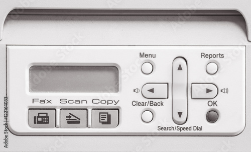 Closeup surface screen of old photocopier and fax machine in the office textured background in black and white tone