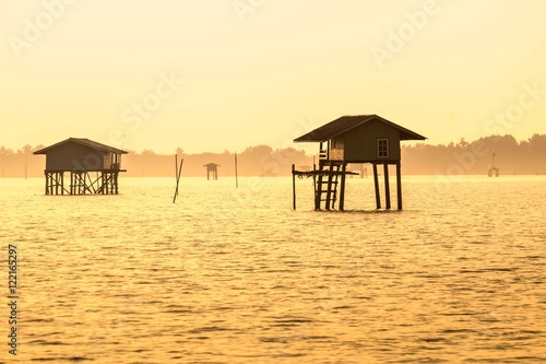 hut of fisherman at sunset time