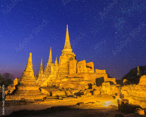 Asian religious architecture. Ancient pagoda at Wat Phra Sri Sanphet temple under stars and space dust in the sky  Ayutthaya  Thailand