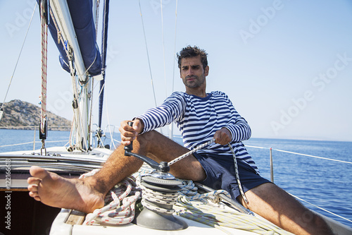 Man in action of pulling rope