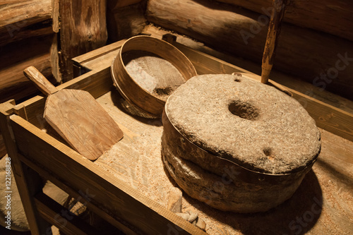 Bild auf Leinwand Old millstones for grinding grain, vintage