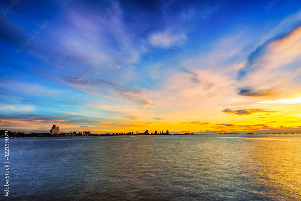 Low light long exposure scenery of pattaya with colorful sunset