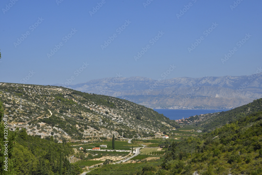Fototapeta premium View over the 2 km deep valley from the little village Dol to Postira, picture from Island Brac in Croatia.