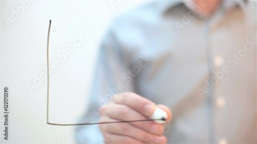 Growth Graph. Man draws on transparent screen
