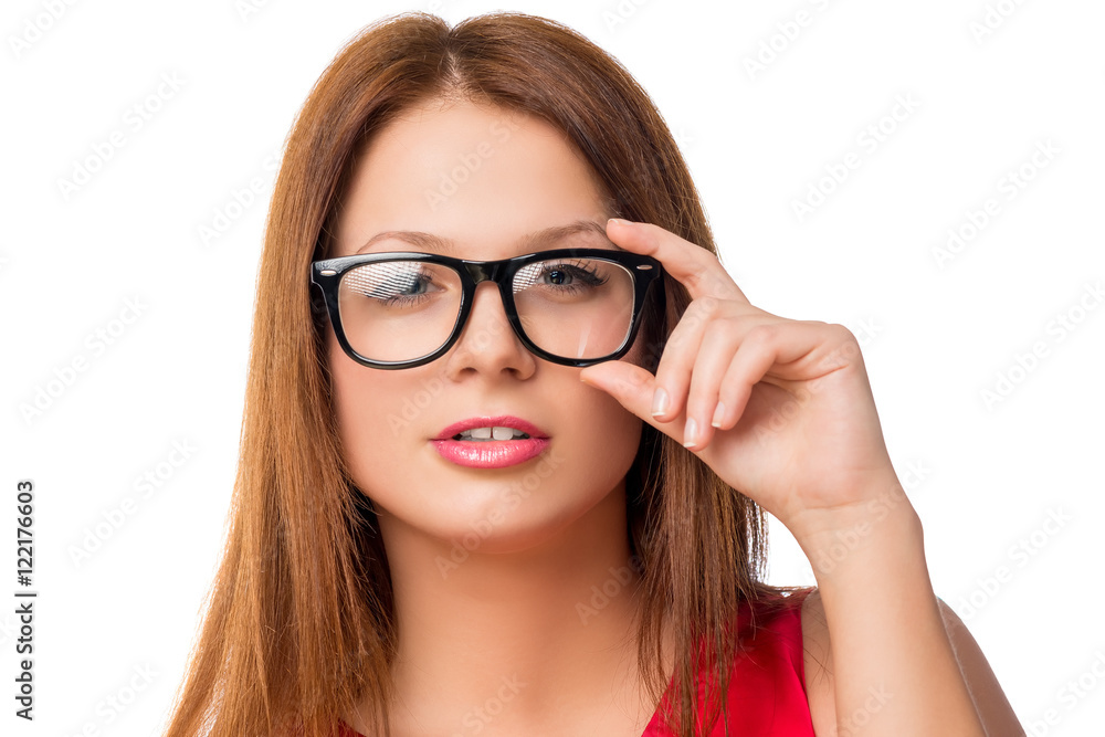 young brunette woman adjusts glasses, face closeup young brunette woman adjusts glasses, face closeup