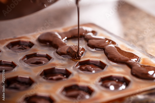 Pouring chocolate in mold