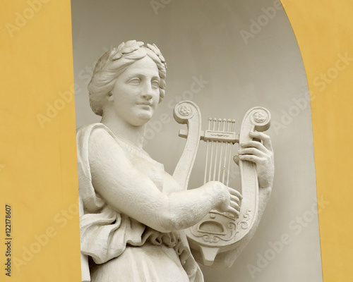 Sculpture of woman with lyre.