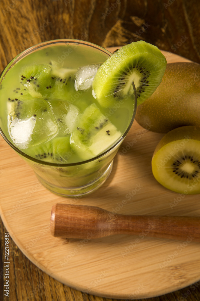 Kiwi Fruit Caipirinha of Brazil on wooden background Kiwi Fruit Caipirinha of Brazil on wooden background
