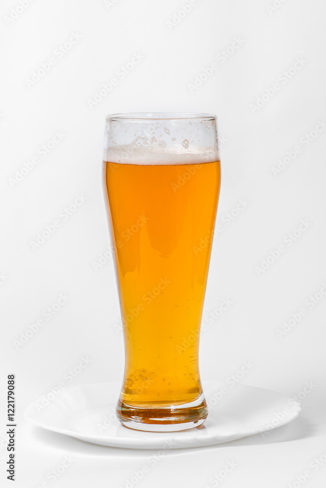 Glass of beer on a plate Glass of beer on a plate