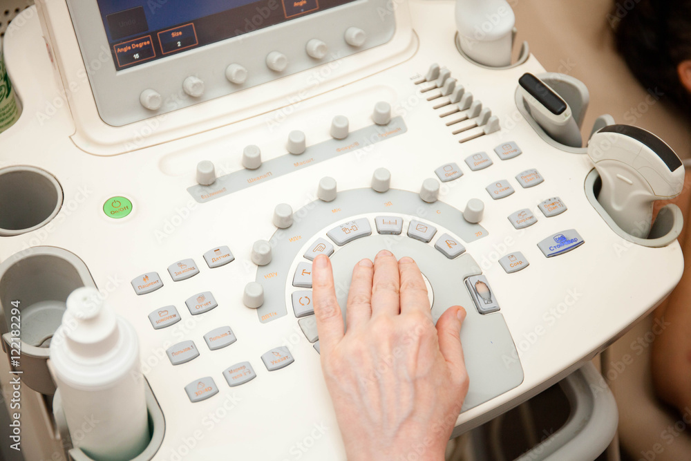 Doctor performing an ultrasound examination Doctor performing an ultrasound examination