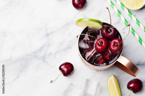 Photography Cold cherry Moscow Mules cocktail with ginger beer, vodka, lime Marble backgroun