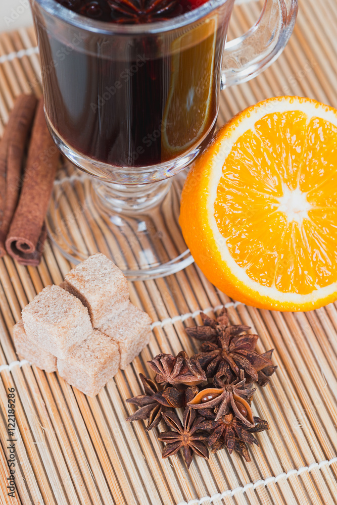 Ingredients for mulled wine: glass orange cinnamon star anise Th