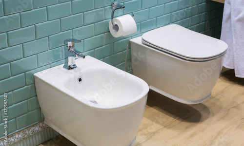 Modern ceramic bidet and lavatory - interior of the restroom, bathroom, toilet photo