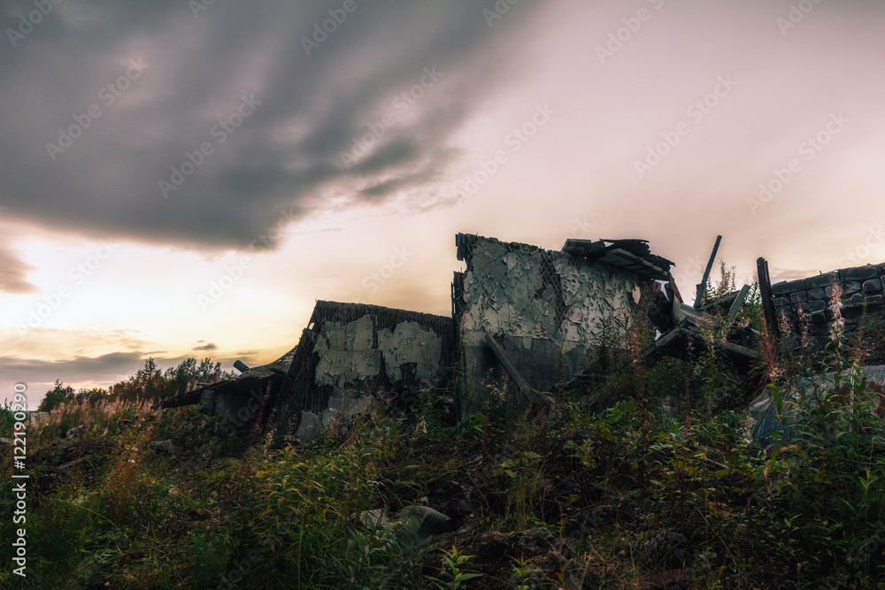 Apocalyptic landscape.The remains of the destroyed buildings in the background of dark sky
