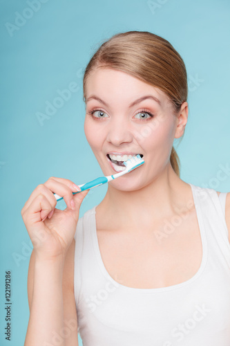 woman with toothbrush brushing cleaning teeth