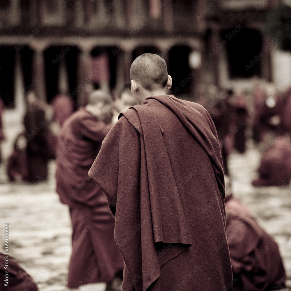 Monks in courtyard Kharchung Goemba, Bumthang District Monks in courtyard Kharchung Goemba, Bumthang District