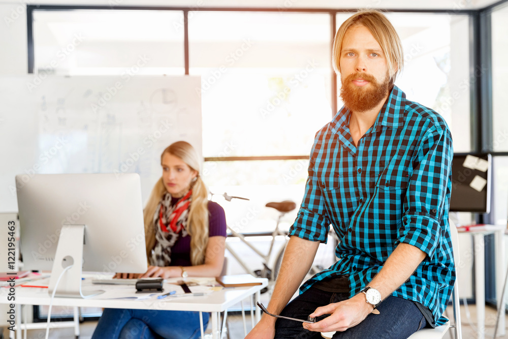 Fototapeta premium Young man working in office