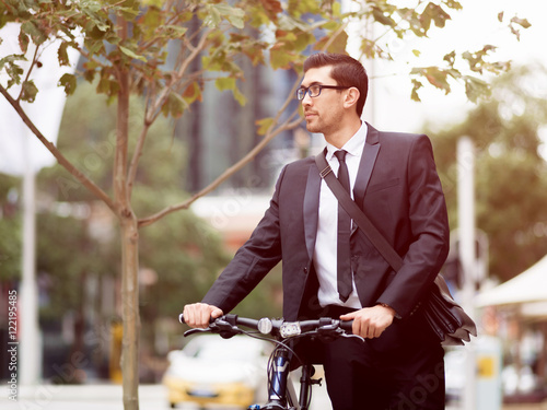 Young businessmen with a bike