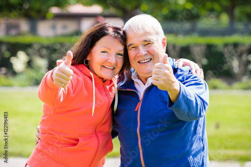 Senior Couple Showing Thumbs Up