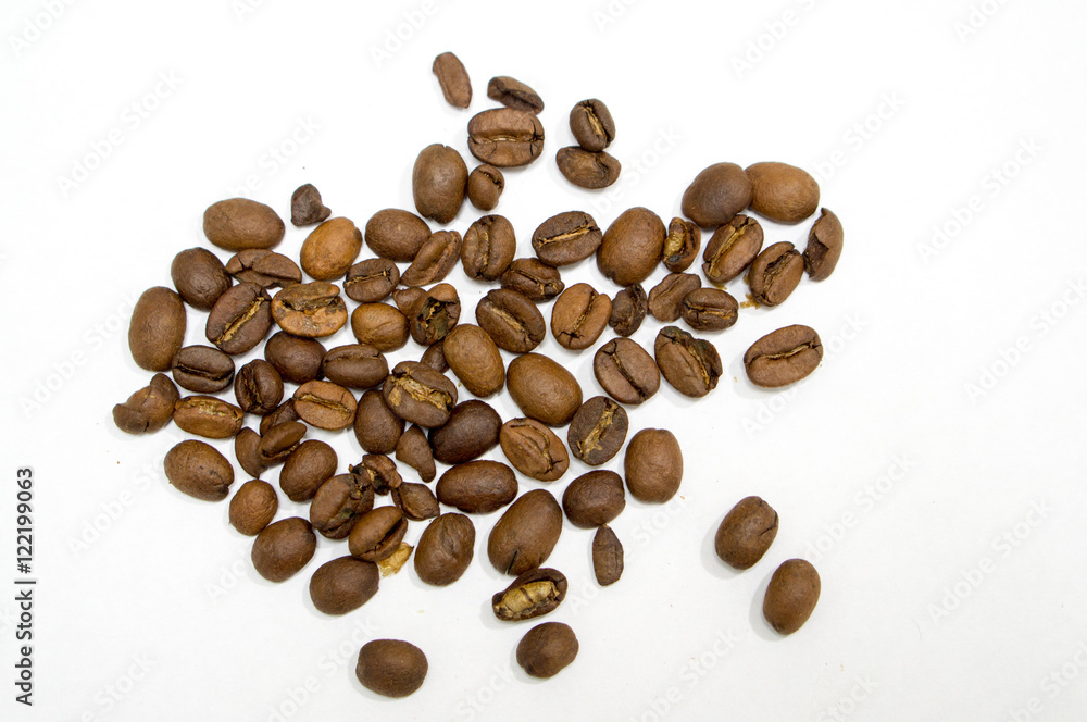 Spilled coffee beans isolated on white Spilled coffee beans isolated on white
