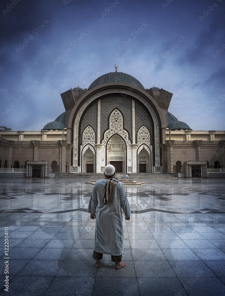 Muslim people praying with mosque interior background