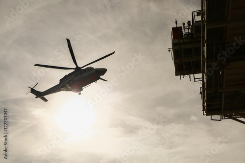 Bild auf Leinwand helicopter parking landing on offshore platform, Helicopter transfer crews or passenger to work in offshore oil and gas industry, air transportation for support passenger, ground service in airport