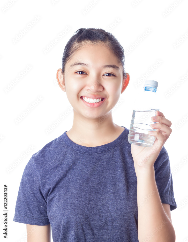 Young happy smiling girl holding a bottle of water Young happy smiling girl holding a bottle of water