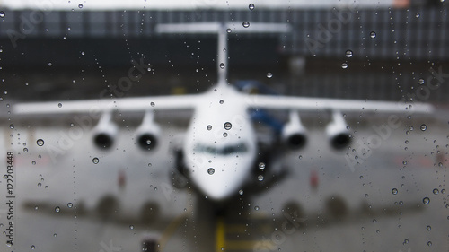 View of the front of an aircraft through a wet window; Munich, Germany photo