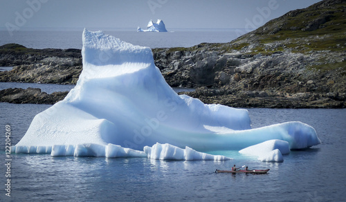 kayakers visit iceberg photo
