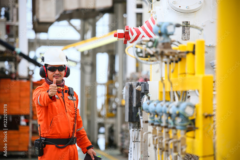 operator recording operation of oil and gas process at oil and rig plant, offshore oil and gas industry, offshore oil and rig in the sea, operator monitor production process, routine daily record. operator recording operation of oil and gas process at oil and rig plant, offshore oil and gas industry, offshore oil and rig in the sea, operator monitor production process, routine daily record.
