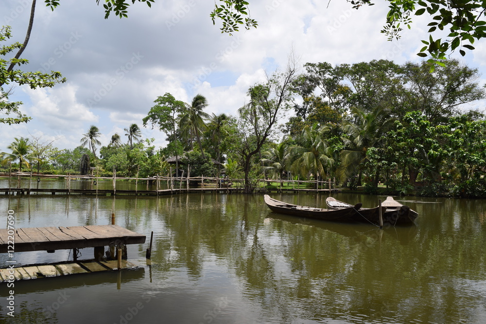 Fototapeta premium traditional asian fishing boat in river