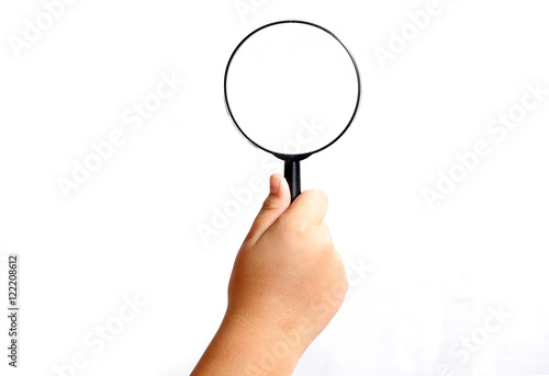 Boy hand holding magnifying glasses