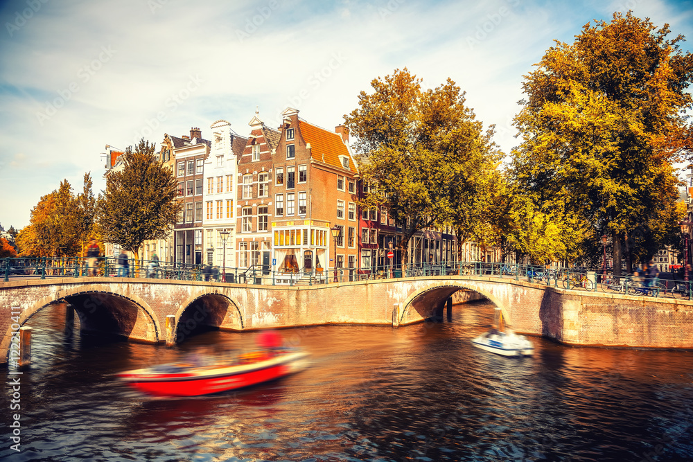 Naklejka premium Bridges over canals in Amsterdam at autumn