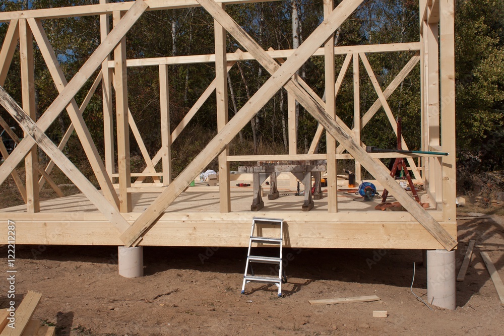 Wooden frame of house under construction.Framed New Construction of a House. Timber house in building process
