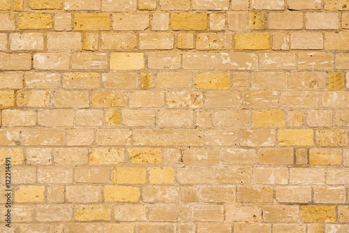 Yellow and brown brick wall, background, texture