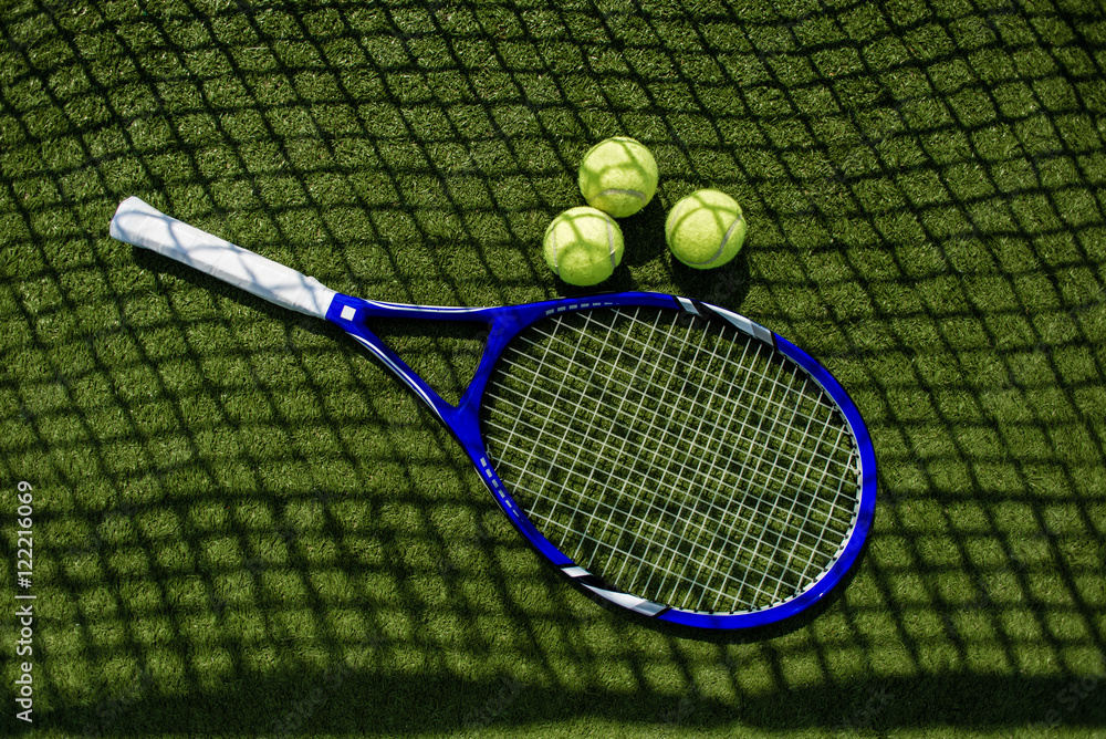 Tennis racket with a set of balls