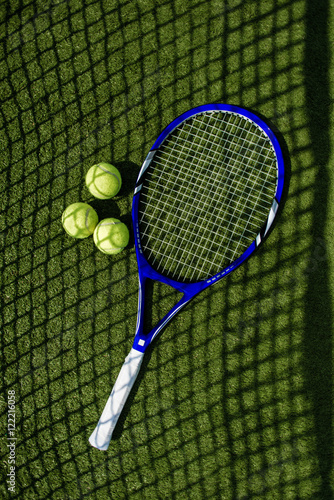 Tennis racket with a set of balls