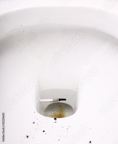 Fotografie Cigarette butt in toilet bowl