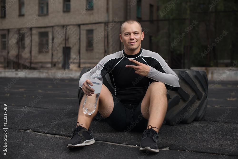 athlete sits at the tire, fatigue athlete sits at the tire, fatigue