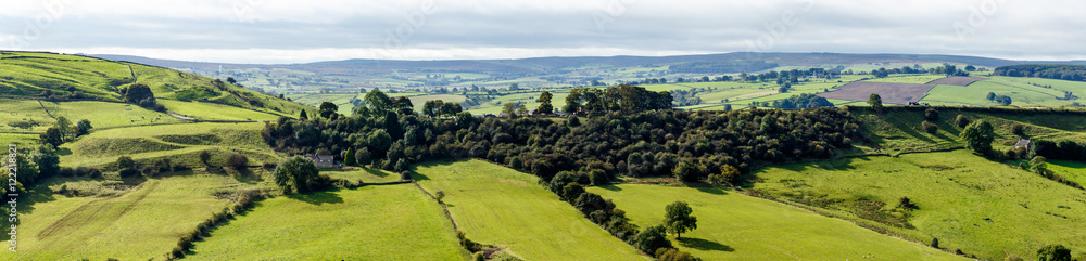 Obraz premium View of farm land and River Dove in Crowdecote