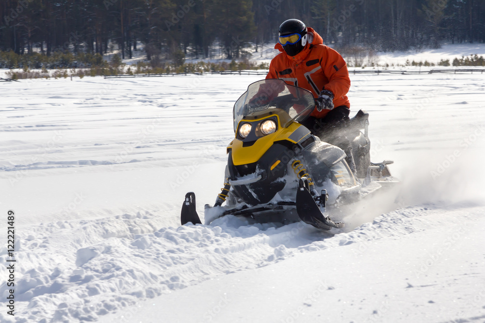 Athlete on a snowmobile.