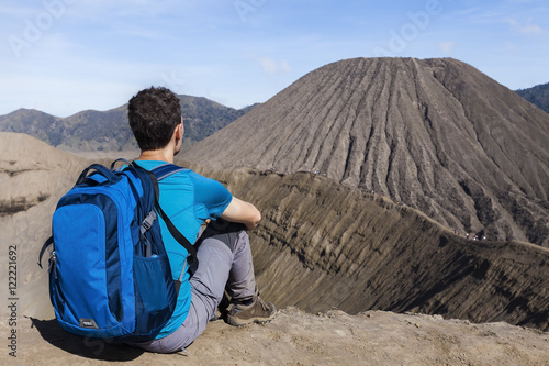 Person watching crater and caldera of Bromo volcano, Java, Indonesia