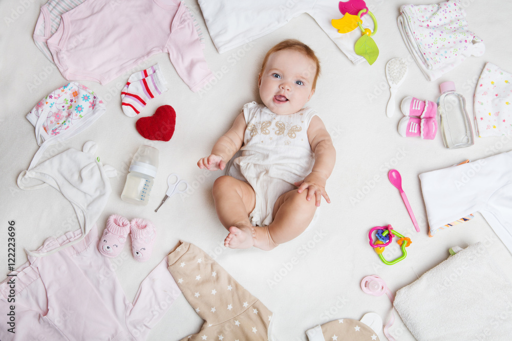 Φωτογραφία Baby on white background with clothing, toiletries, toys and health care accessories
