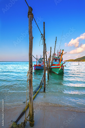 Fishing boats on the beach, sunset