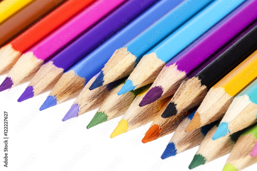 Chipped colored crayons on white background, close up Chipped colored crayons on white background, close up