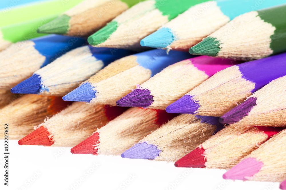 Chipped colored crayons on white background, close up Chipped colored crayons on white background, close up