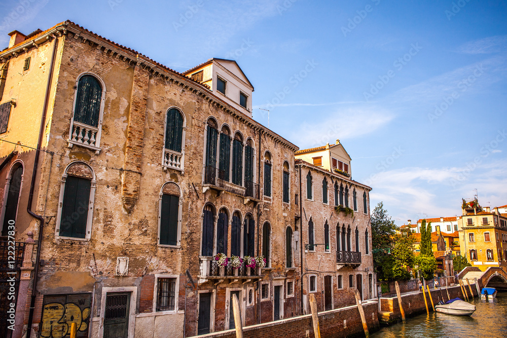 VENICE, ITALY - AUGUST 18, 2016: Famous architectural monuments and colorful facades of old medieval buildings close-up on August 18, 2016 in Venice, Italy.