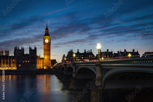 Big Ben and the Houses of Parliament at night from across the river Thames and Westminster bridge southbank in London  England  UK