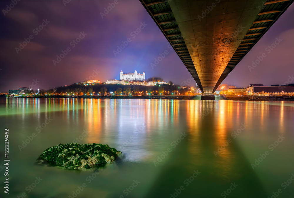Bratislava castle,parliament and Danune river in capital city of Slovakia,Bratislava. Beautiful night reflection during winter time.