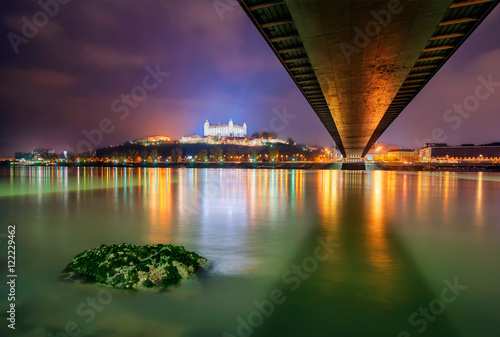 Bratislava castle parliament and Danune river in capital city of Slovakia Bratislava. Beautiful night reflection during winter time.